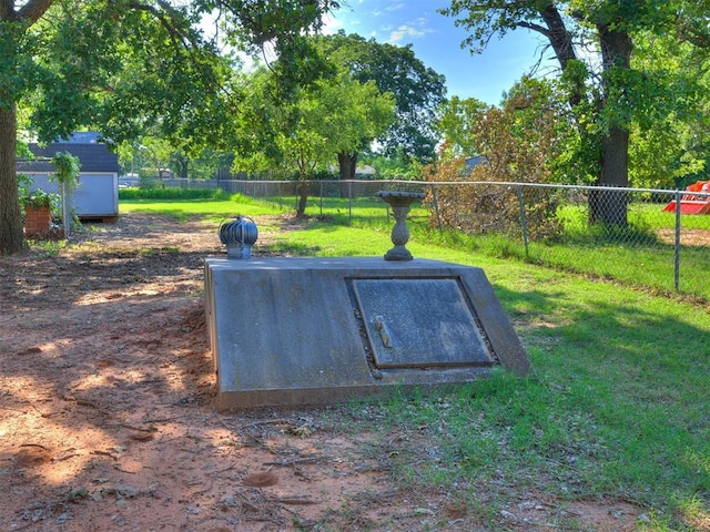 1124 Hill View Dr, Guthrie, OK 73044 - entry to storm shelter featuring a fenced backyard