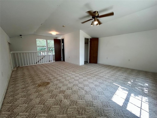 1124 Hill View Dr, Guthrie, OK 73044 - empty room with vaulted ceiling, a ceiling fan, and carpet