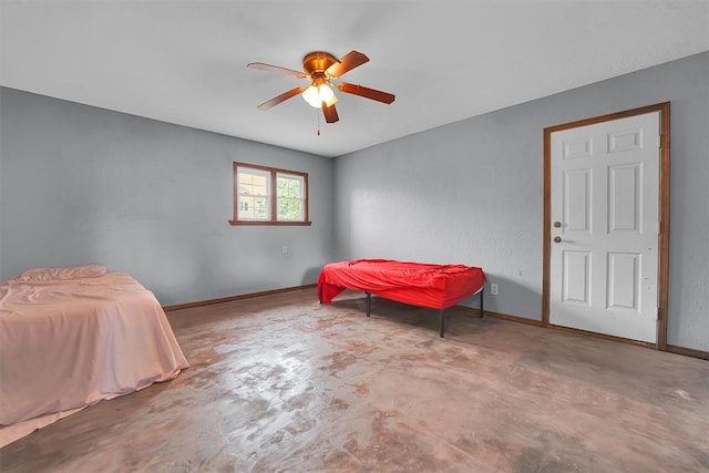 231 W Polk St, Mangum, OK 73554 - bedroom featuring concrete flooring and a ceiling fan