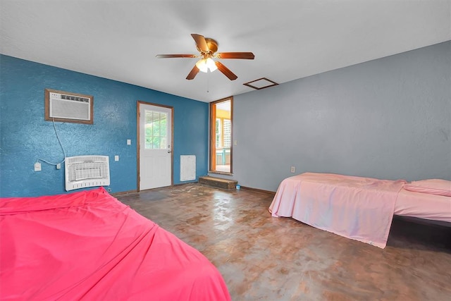 231 W Polk St, Mangum, OK 73554 - bedroom with heating unit, finished concrete floors, a textured wall, an AC wall unit, and ceiling fan