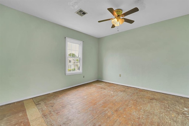 231 W Polk St, Mangum, OK 73554 - unfurnished room with a ceiling fan and wood-type flooring
