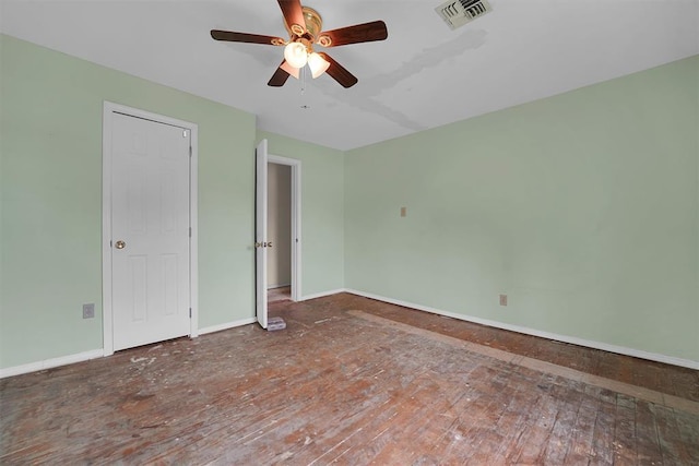 231 W Polk St, Mangum, OK 73554 - unfurnished bedroom featuring wood finished floors and a ceiling fan