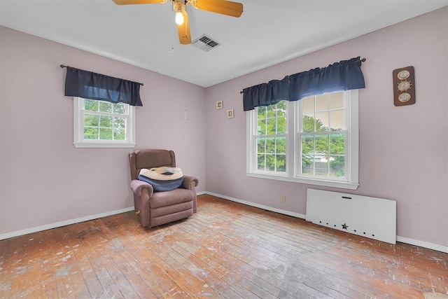 231 W Polk St, Mangum, OK 73554 - sitting room featuring hardwood / wood-style flooring and ceiling fan