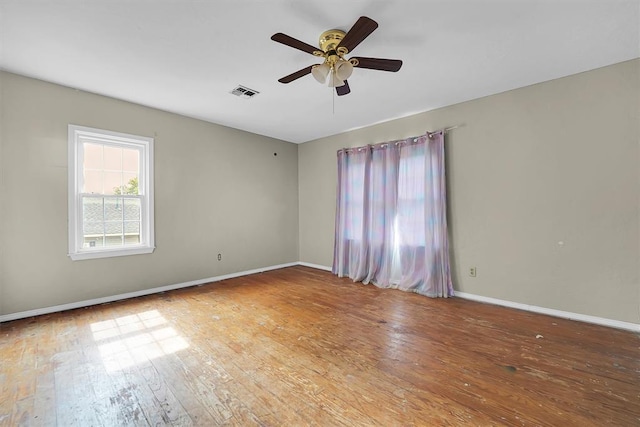 231 W Polk St, Mangum, OK 73554 - empty room with ceiling fan and wood-type flooring