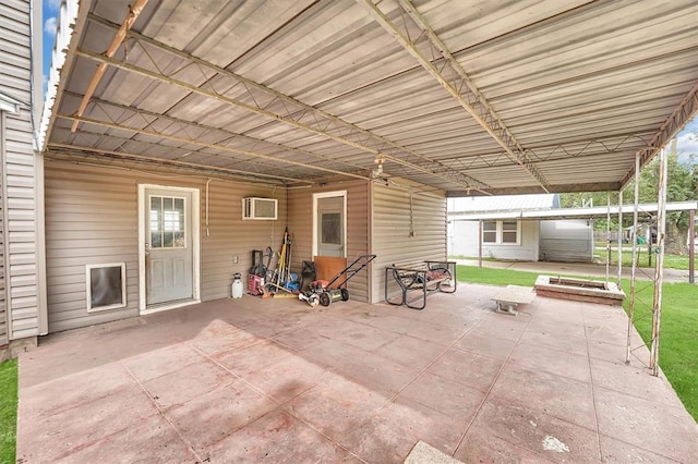 231 W Polk St, Mangum, OK 73554 - view of patio / terrace featuring an AC wall unit