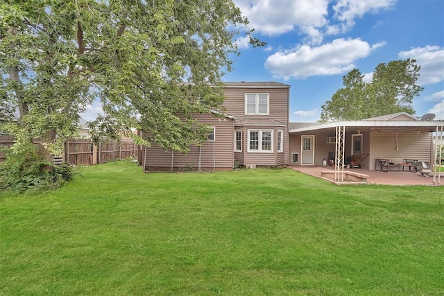 231 W Polk St, Mangum, OK 73554 - back of property with a patio area