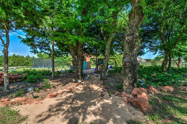 13420 Saltgrass Dr, Edmond, OK 73025 - view of yard with a trampoline