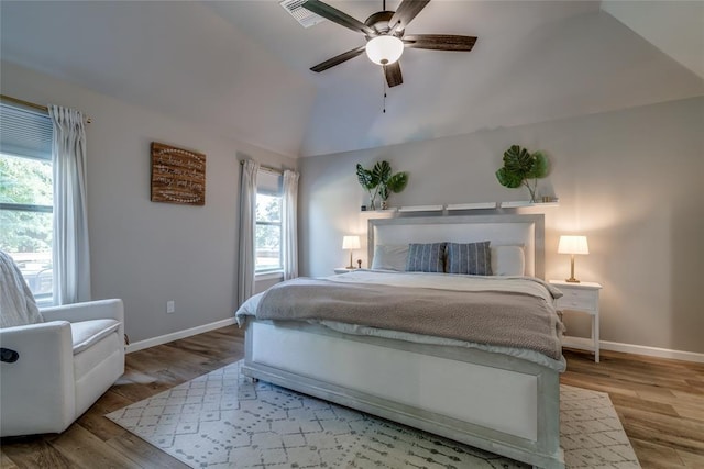 13420 Saltgrass Dr, Edmond, OK 73025 - bedroom featuring lofted ceiling, wood finished floors, and a ceiling fan