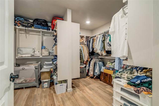 13420 Saltgrass Dr, Edmond, OK 73025 - spacious closet with wood finished floors