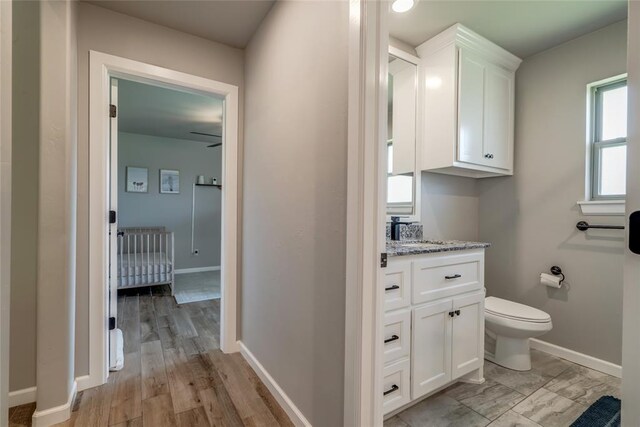 13420 Saltgrass Dr, Edmond, OK 73025 - bathroom featuring vanity and wood finished floors