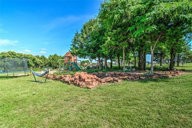 13420 Saltgrass Dr, Edmond, OK 73025 - view of playground featuring a trampoline and a lawn