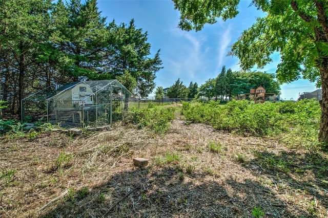 13420 Saltgrass Dr, Edmond, OK 73025 - view of yard with an outdoor structure