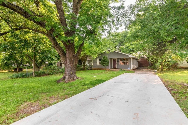 304 S 4th St, Noble, OK 73068 - view of front of property featuring a front yard and concrete driveway