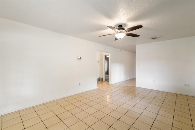 304 S 4th St, Noble, OK 73068 - spare room with ceiling fan, light tile patterned flooring, and a textured ceiling