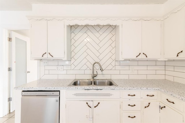 304 S 4th St, Noble, OK 73068 - kitchen with dishwashing machine, tasteful backsplash, white cabinets, and light stone countertops