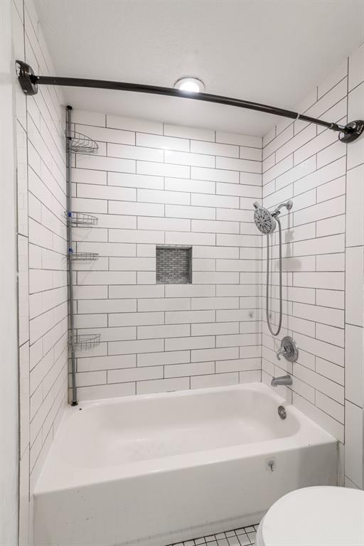 304 S 4th St, Noble, OK 73068 - full bathroom featuring washtub / shower combination and tile patterned floors