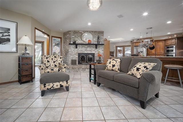 2205 SE 90th St, Lawton, OK 73501 - living room featuring light tile patterned flooring, a brick fireplace, and recessed lighting