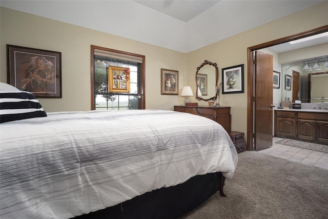 2205 SE 90th St, Lawton, OK 73501 - bedroom featuring light tile patterned flooring, light colored carpet, and connected bathroom