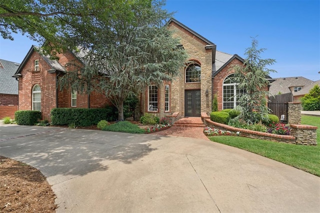 4609 Flint Ridge Dr, Norman, OK 73072 - view of front of property with brick siding and french doors