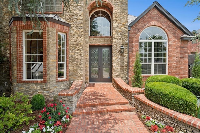 4609 Flint Ridge Dr, Norman, OK 73072 - entrance to property featuring french doors, stone siding, and brick siding
