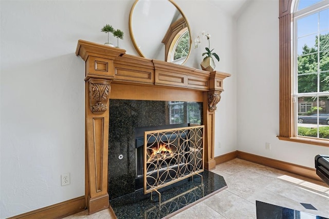 4609 Flint Ridge Dr, Norman, OK 73072 - detailed view of baseboards and a tile fireplace