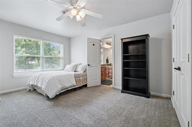 4609 Flint Ridge Dr, Norman, OK 73072 - carpeted bedroom featuring ceiling fan and ensuite bathroom