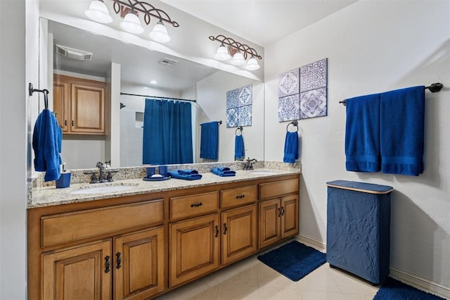 4609 Flint Ridge Dr, Norman, OK 73072 - full bath featuring double vanity, curtained shower, and tile patterned floors