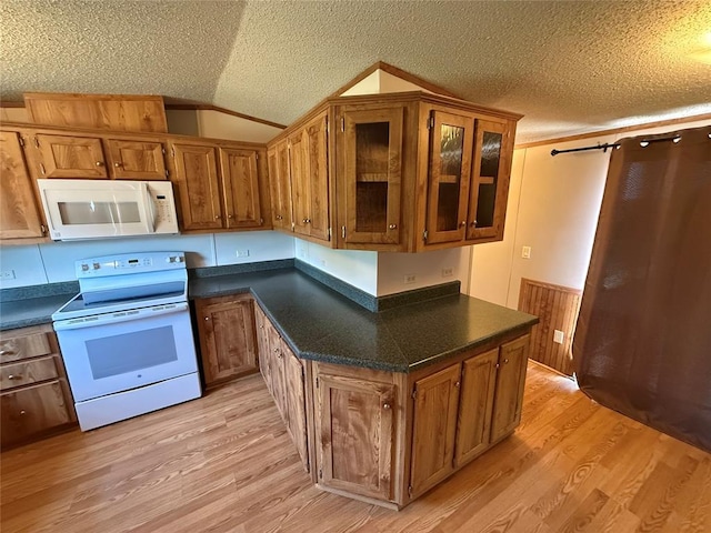 339133 E 870th Rd, Chandler, OK 74834 - kitchen with white appliances, light wood-style floors, dark countertops, a textured ceiling, and vaulted ceiling
