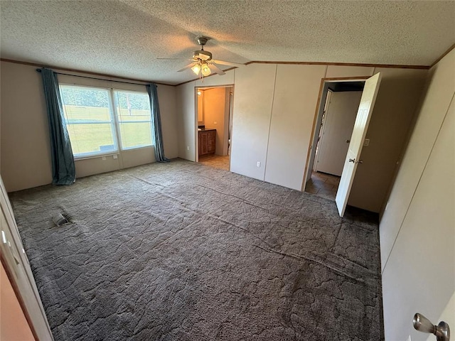 339133 E 870th Rd, Chandler, OK 74834 - unfurnished bedroom featuring a textured ceiling, vaulted ceiling, carpet floors, ornamental molding, and a ceiling fan