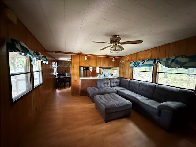 120347 S 4186th Rd, Eufaula, OK 74432 - living room featuring wooden walls, light wood-type flooring, and a ceiling fan