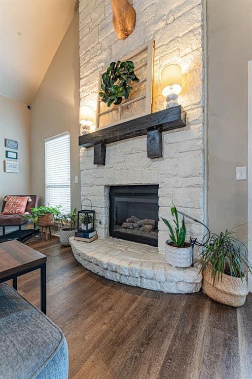 2432 NW 175th St, Edmond, OK 73012 - living room featuring wood finished floors, high vaulted ceiling, and a fireplace