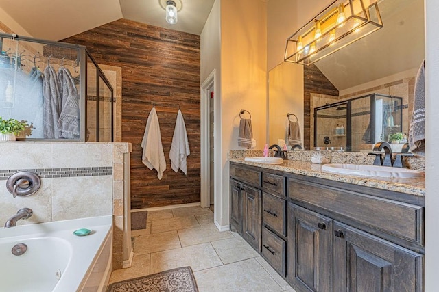 2432 NW 175th St, Edmond, OK 73012 - bathroom with vaulted ceiling, wood walls, a shower stall, a garden tub, and double vanity