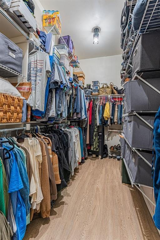 2432 NW 175th St, Edmond, OK 73012 - walk in closet with wood finished floors