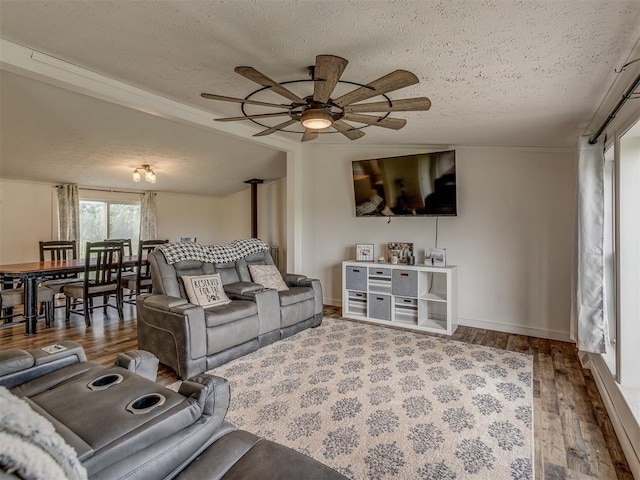 7401 E Forrest Hills Rd, Guthrie, OK 73044 - living room featuring a textured ceiling, a ceiling fan, and wood finished floors