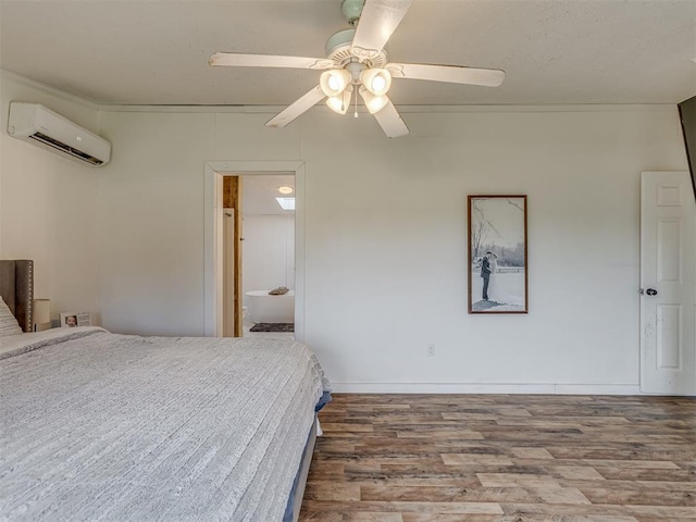 7401 E Forrest Hills Rd, Guthrie, OK 73044 - unfurnished bedroom featuring a wall mounted air conditioner, wood finished floors, and a ceiling fan