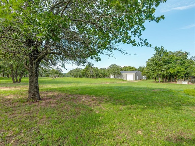7401 E Forrest Hills Rd, Guthrie, OK 73044 - view of grassy yard featuring a detached garage