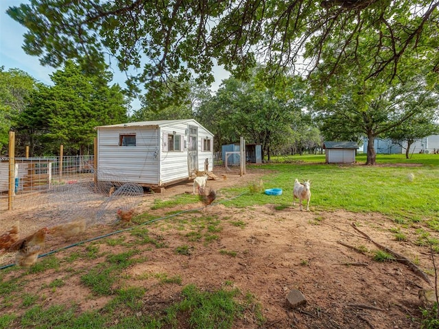 7401 E Forrest Hills Rd, Guthrie, OK 73044 - view of yard with a storage shed and exterior structure