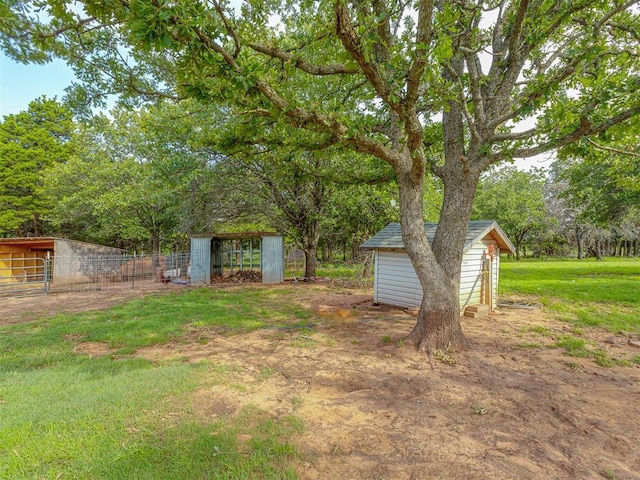 7401 E Forrest Hills Rd, Guthrie, OK 73044 - view of yard featuring a storage unit