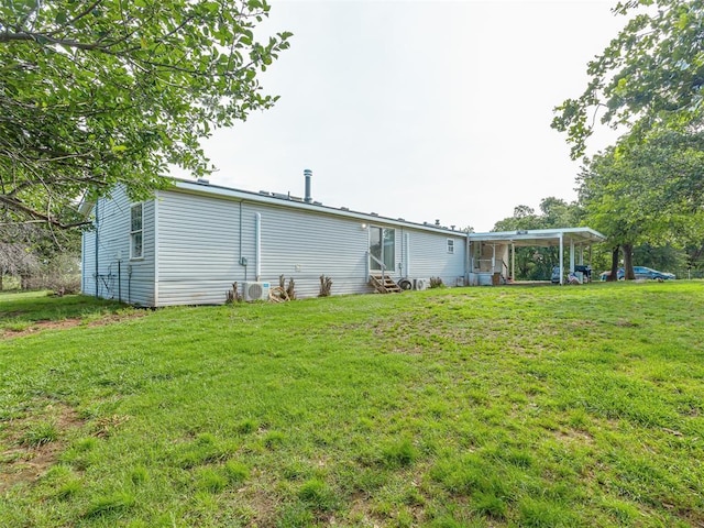 7401 E Forrest Hills Rd, Guthrie, OK 73044 - back of house featuring entry steps and a yard