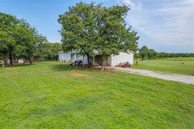 7401 E Forrest Hills Rd, Guthrie, OK 73044 - view of green lawn with gravel driveway