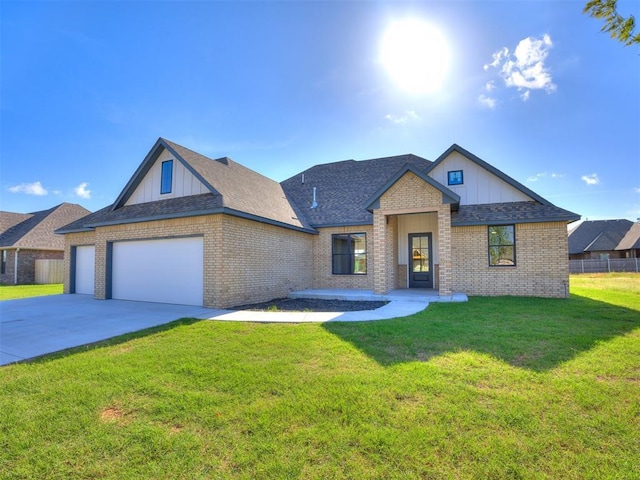 1136 Jozie Way, Tuttle, OK 73089 - view of front of home featuring board and batten siding, an attached garage, and brick siding