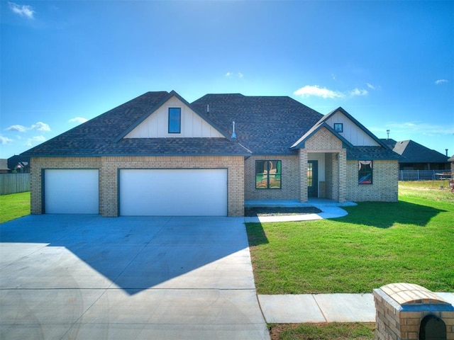 1136 Jozie Way, Tuttle, OK 73089 - view of front of property featuring brick siding, concrete driveway, and a shingled roof