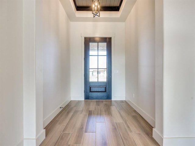 1136 Jozie Way, Tuttle, OK 73089 - entryway featuring a tray ceiling and wood finished floors