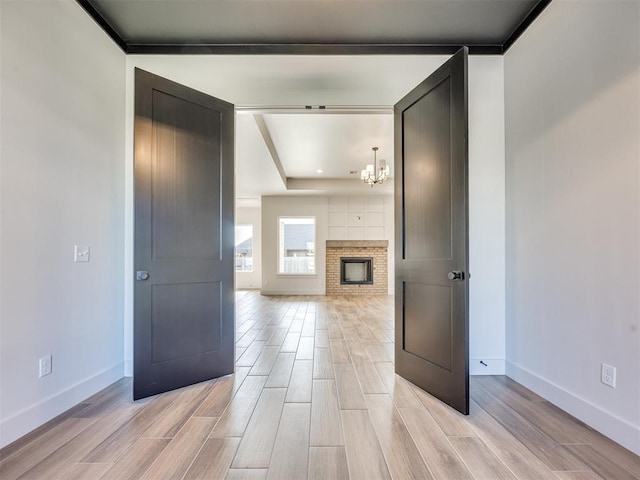1136 Jozie Way, Tuttle, OK 73089 - hall with light wood-style floors and a chandelier