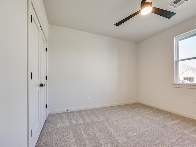 1136 Jozie Way, Tuttle, OK 73089 - unfurnished bedroom with light carpet and a ceiling fan