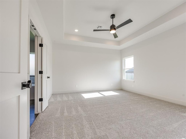 1136 Jozie Way, Tuttle, OK 73089 - carpeted spare room featuring a ceiling fan, a tray ceiling, and recessed lighting