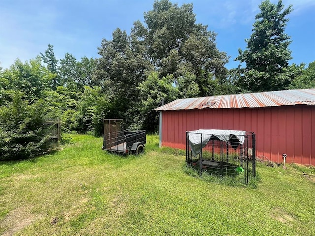 1003 Lukfata St, Broken Bow, OK 74728 - view of green lawn with an outdoor structure