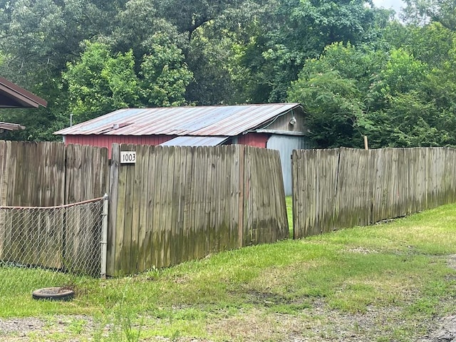 1003 Lukfata St, Broken Bow, OK 74728 - view of outdoor structure with a fenced backyard