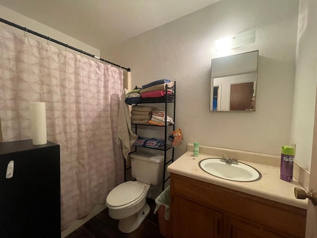 1003 Lukfata St, Broken Bow, OK 74728 - bathroom with vanity, a textured wall, and curtained shower