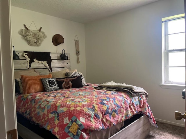 1003 Lukfata St, Broken Bow, OK 74728 - bedroom with carpet floors and baseboards